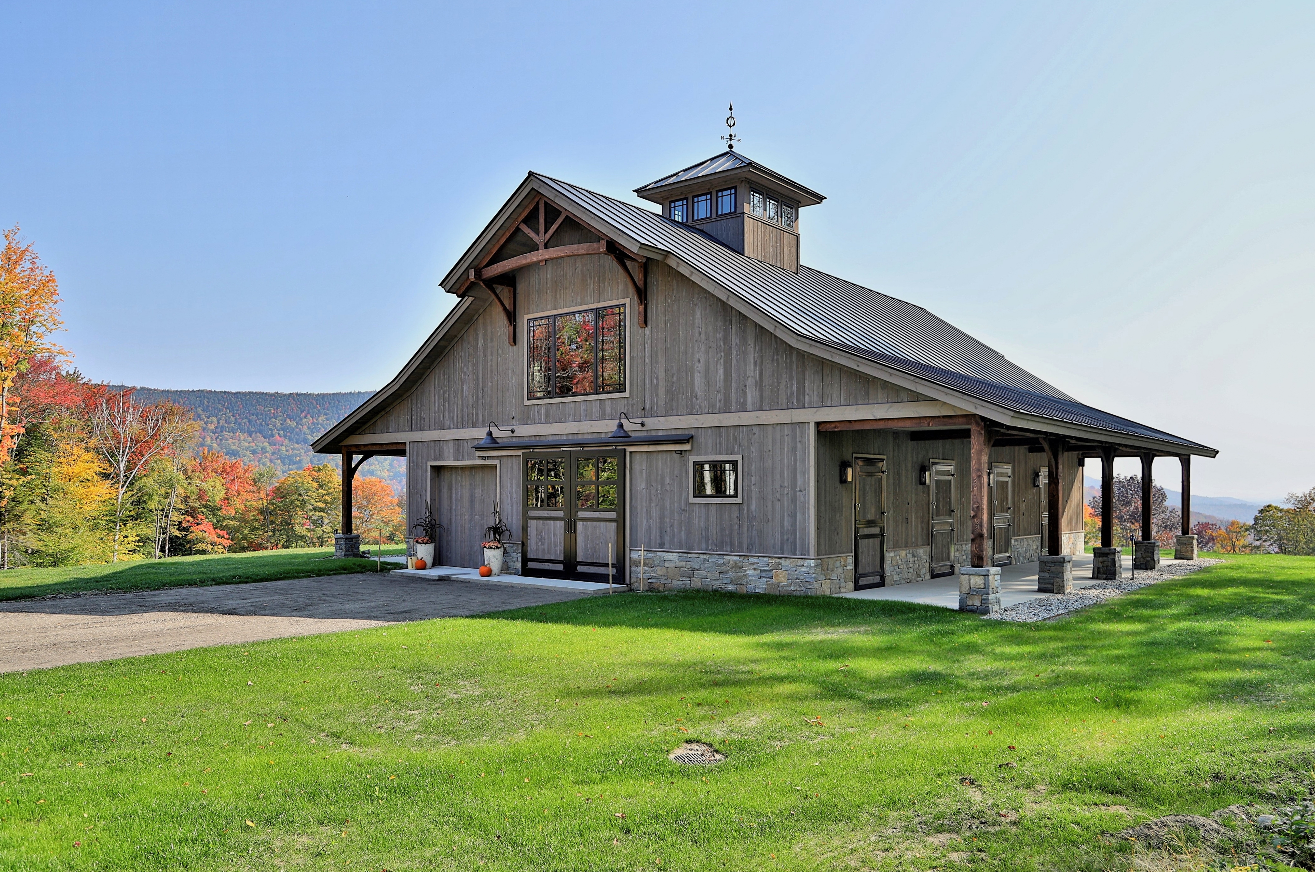 Horse stalls, pavers, and wash bay and barn doors from Classic Equine